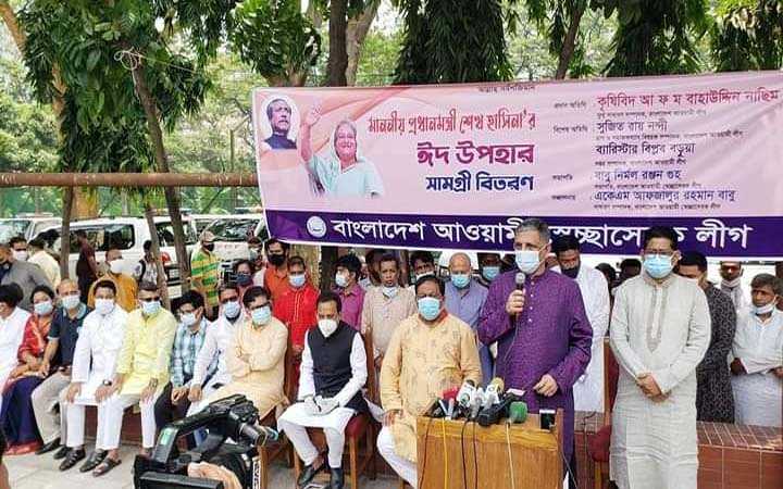 distribution of eid gifts among helpless people at the initiative of bangladesh awami swechasebak league in dhaka