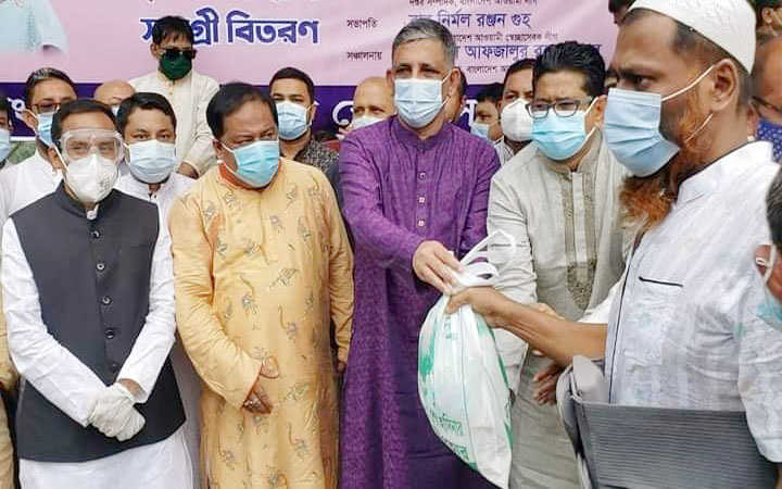 distribution of eid gifts among helpless people at the initiative of bangladesh awami swechasebak league in dhaka