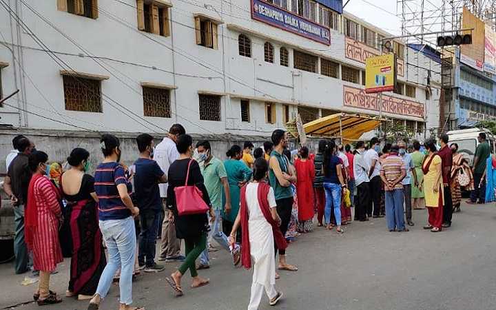 ordinary people standing in line and not getting vaccinated