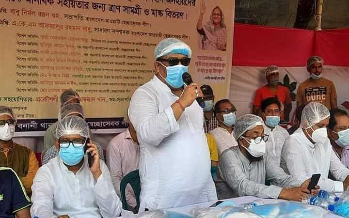 distribution of masks head covers and food items at the initiative of awami swechasebak league in dhaka