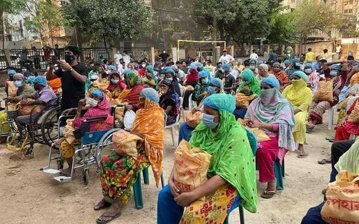 distribution of masks head covers and food items at the initiative of awami swechasebak league in dhaka