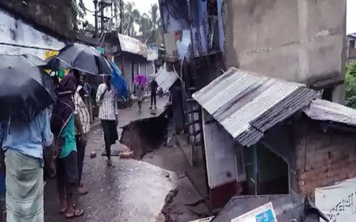 officials inspect damaged houses and shops in uluberia which collapsed due to torrential rains